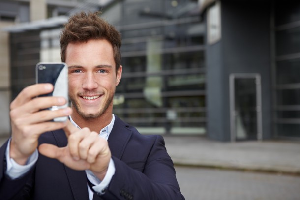 Man takes picture with smartphone